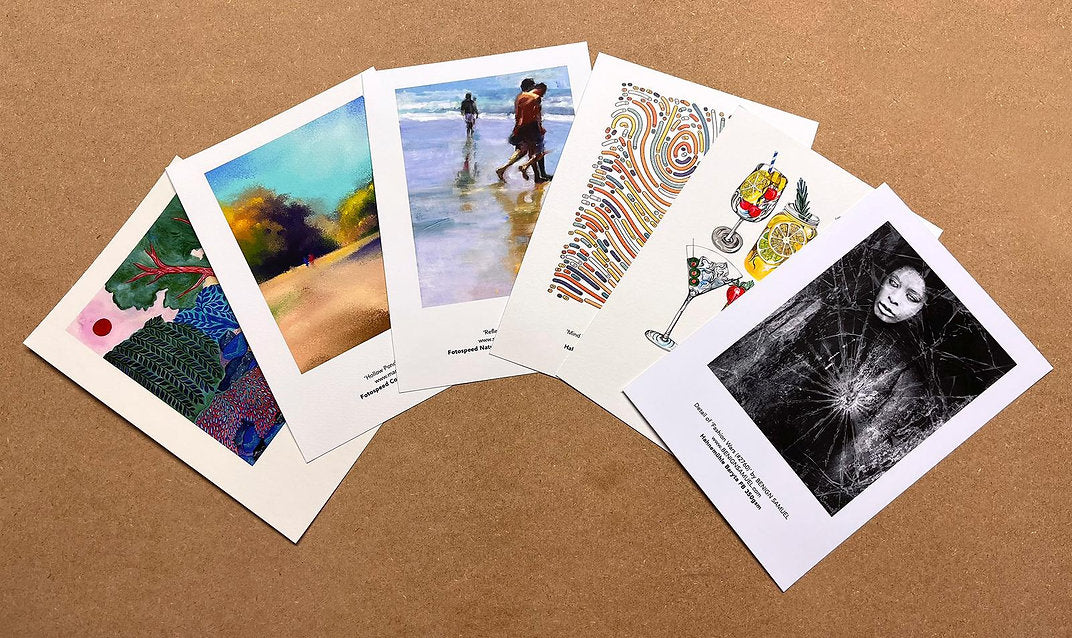 Collection of various printed cards on a brown surface