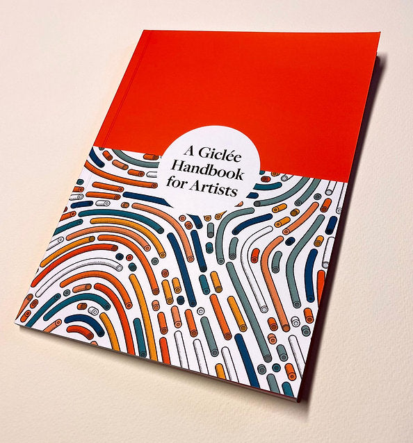 Book titled 'A Gicleé Handbook for Artists' with a red top cover and colorful abstract design on a beige background