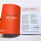 Open book with orange and white pages on a white background