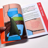 Open book with colorful illustration and text on a white background