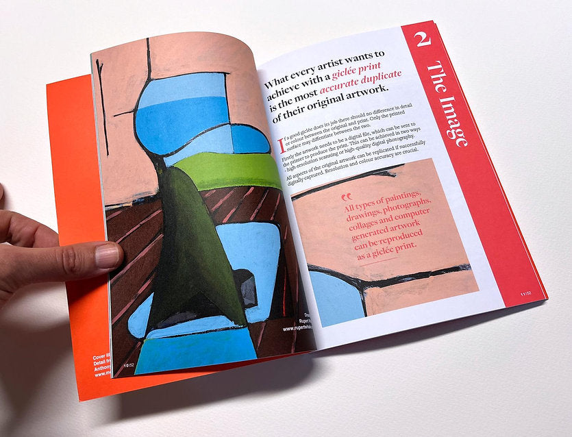 Open book with colorful illustration and text on a white background
